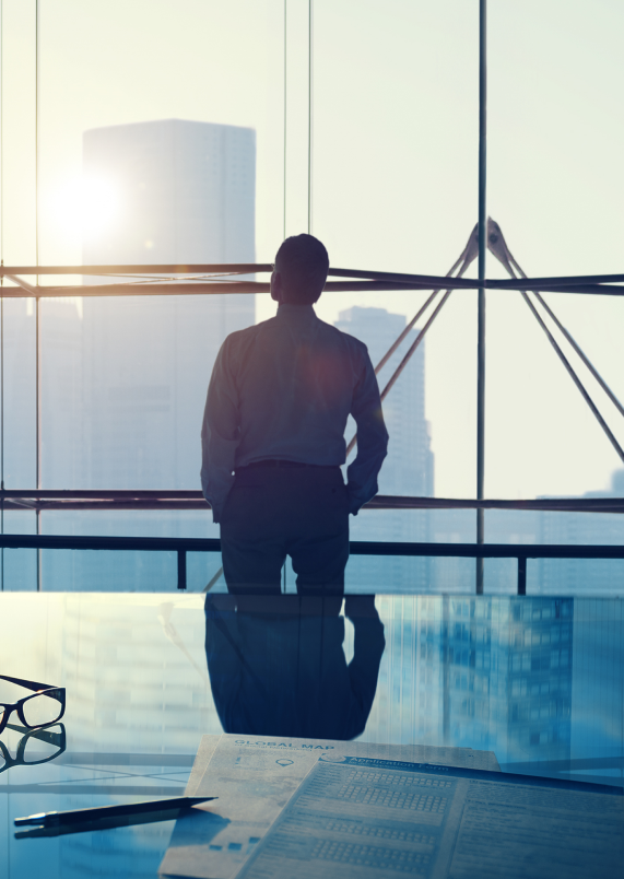 Businessman looking out window